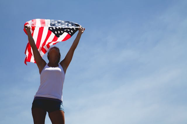 woman holding american flag